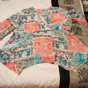 A VERY BEAUTIFUL STYLISH BLOUSE WITH SELF TIE BACK